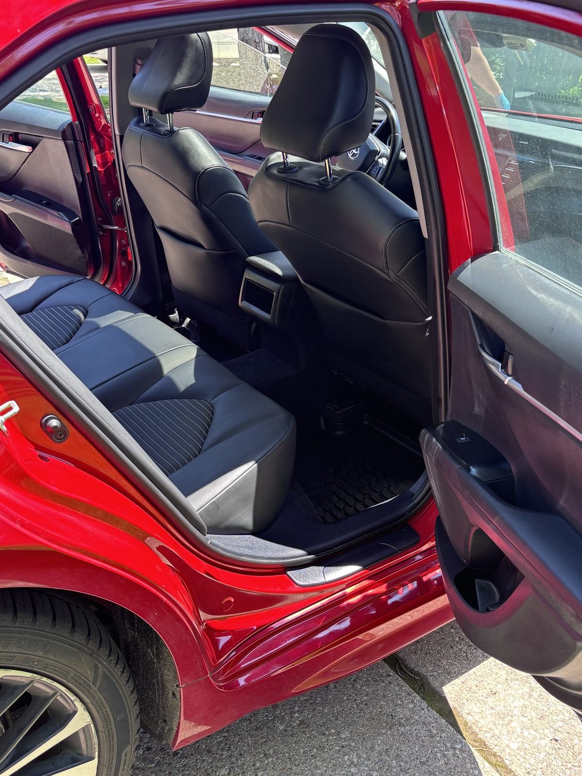 After detailing: spotless black leather back seat deep-cleaned by Buffalo Diamond Detailing