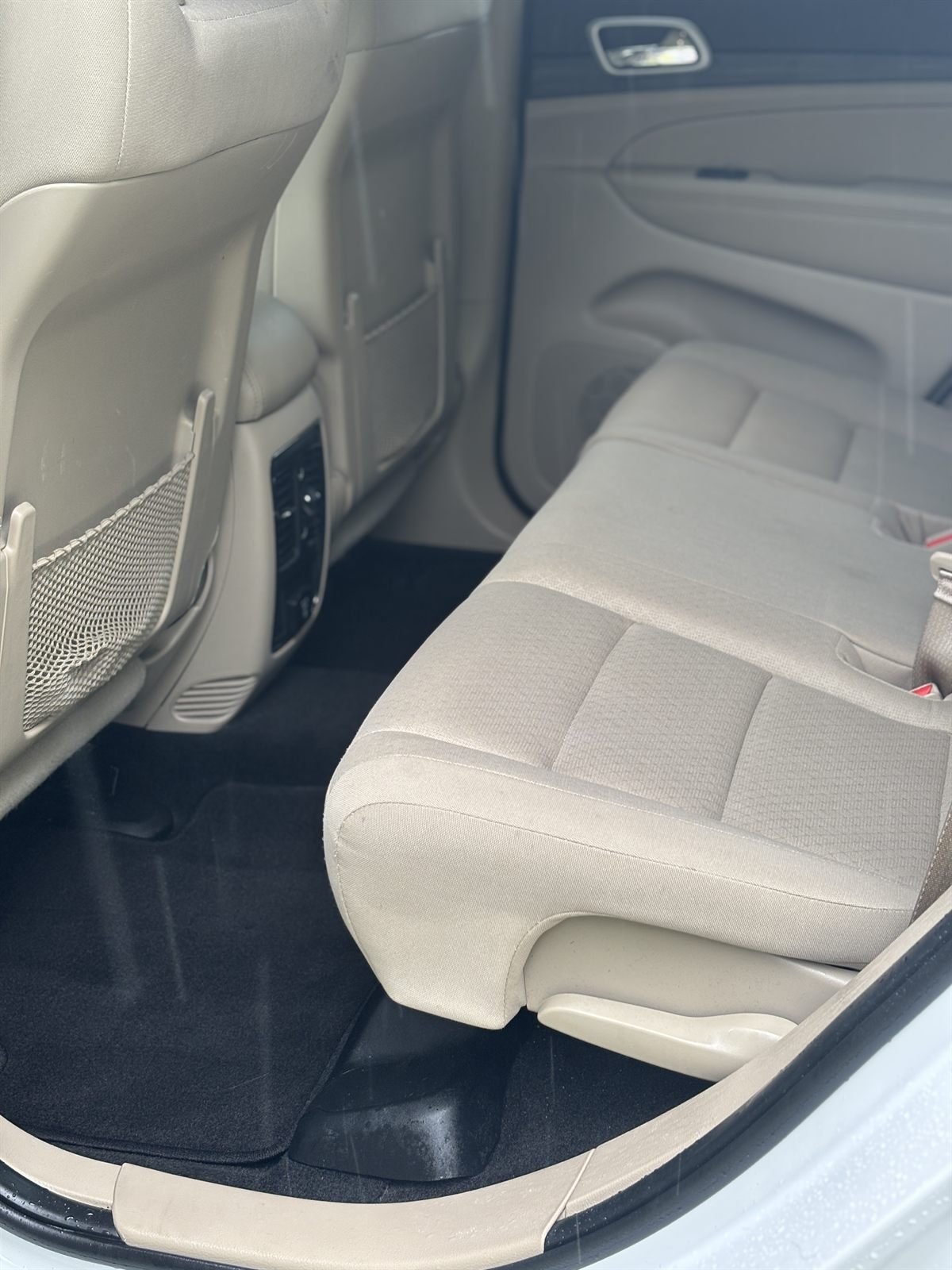 After detailing: spotless tan rear bench and carpet cleaned by Buffalo Diamond Detailing