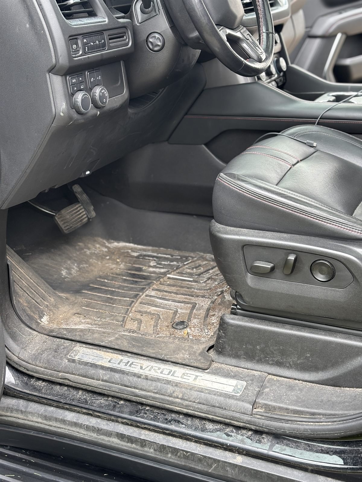 Before detailing: dirty driver-side sill and floor of a truck