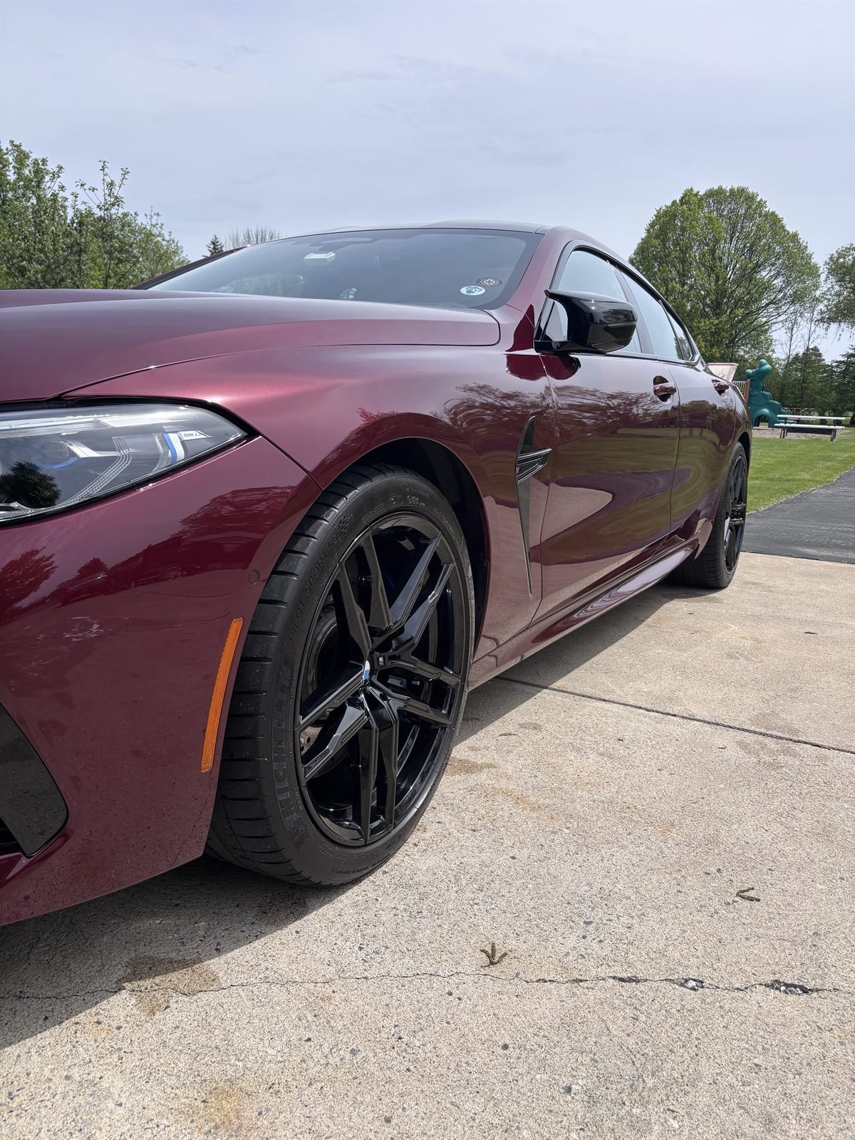 Mobile detailer cleaning a vehicle on-location in a Western New York driveway
